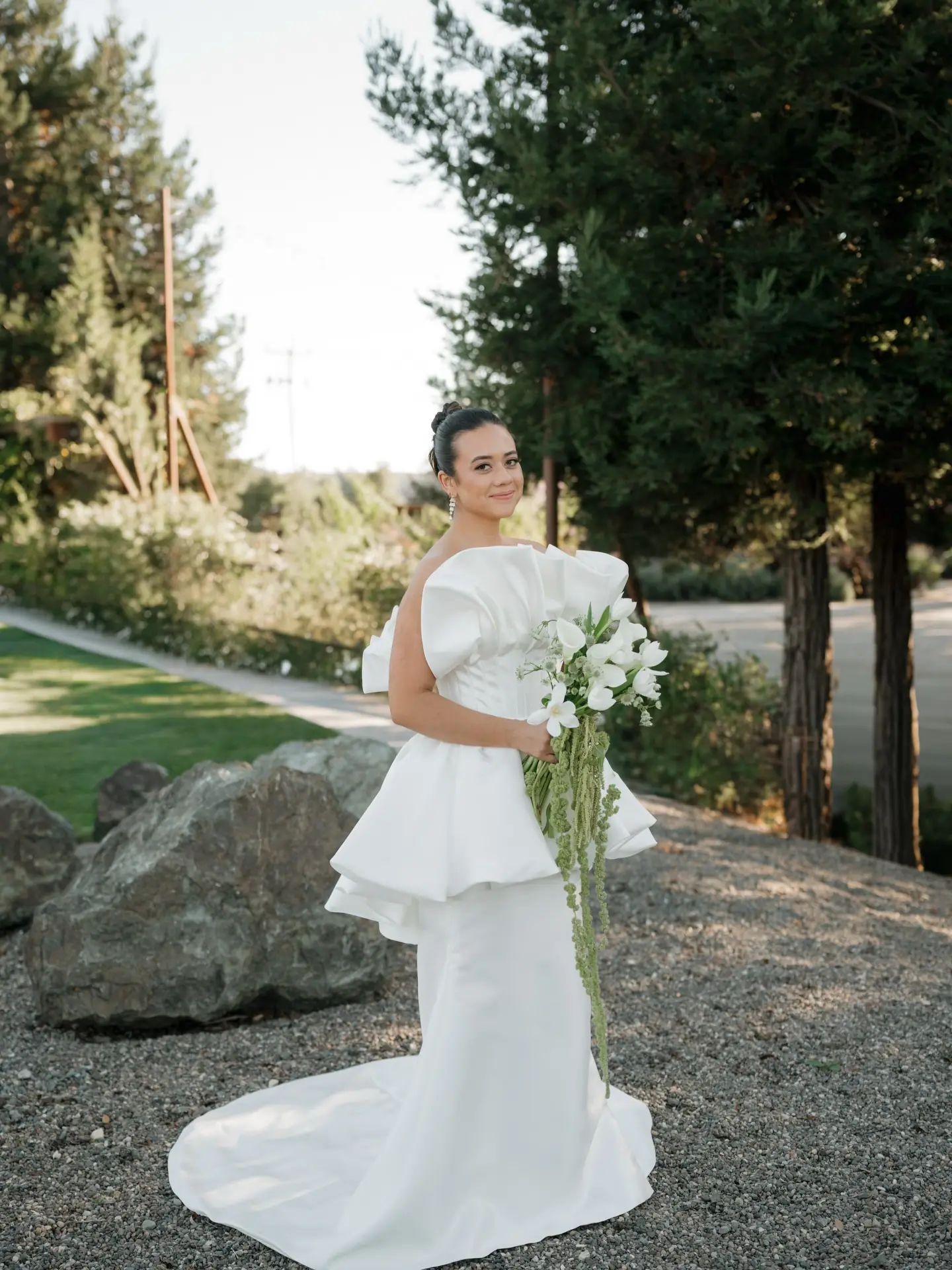 A bride on the grounds at Cavalli Estates