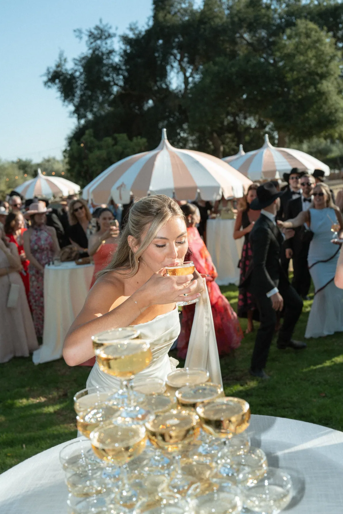A garden wedding reception under market umbrellas