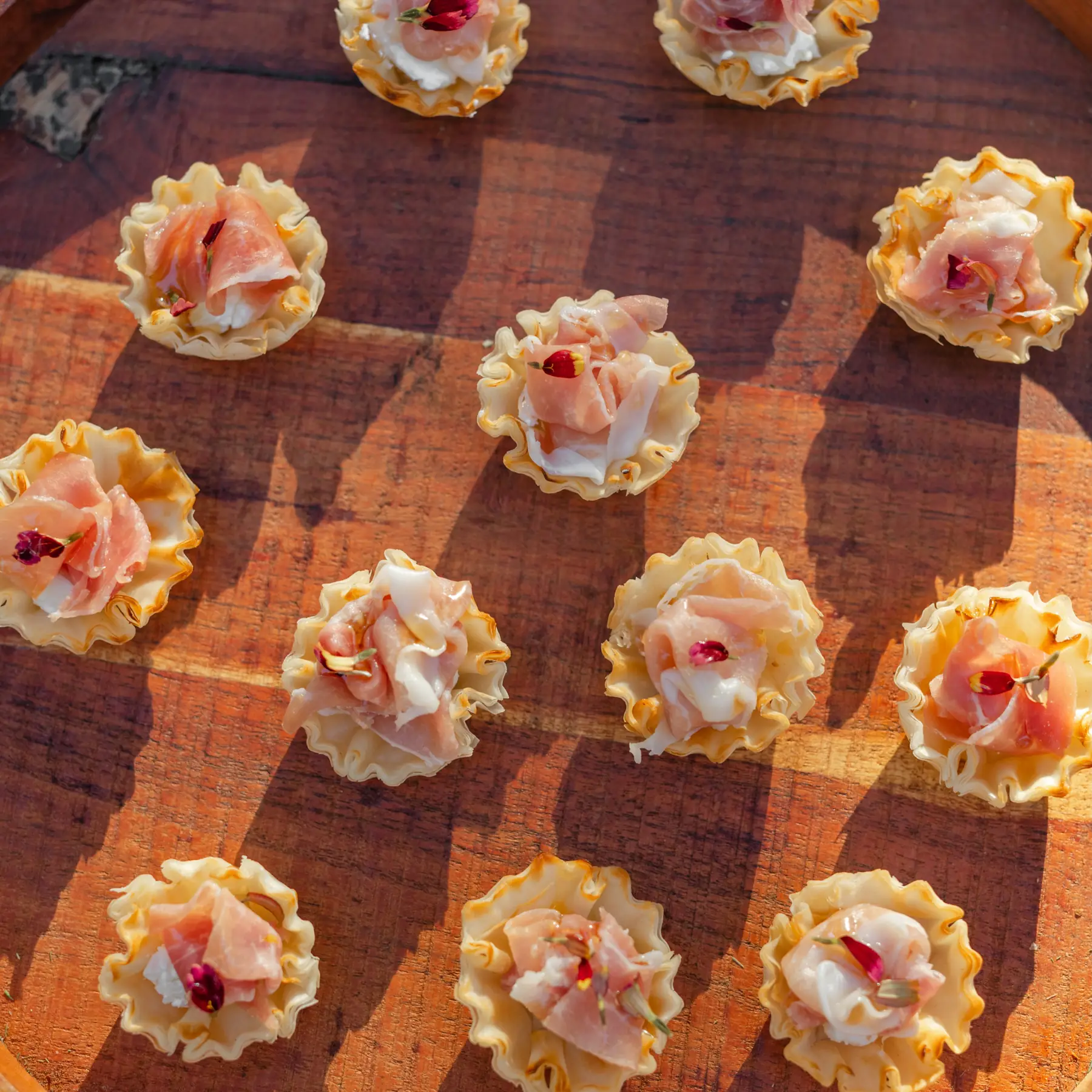 Phyllo cup canapés on a wooden board at Zaca Lake